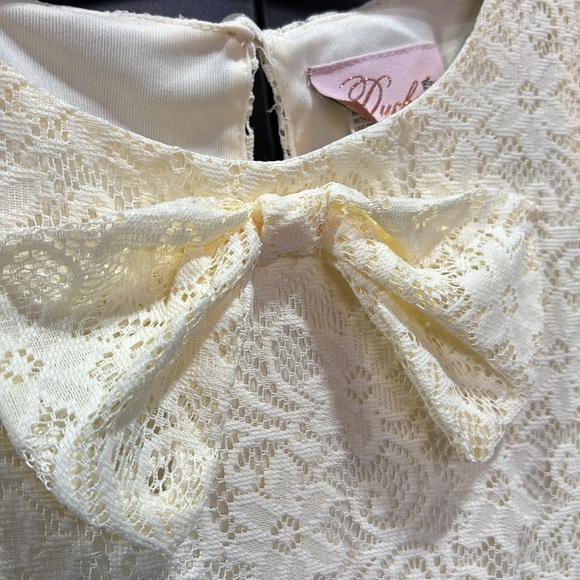 Duchess Lace Overlay, lined,bow-front,keyhole button back,sleeveless flowy dress - Picture 2 of 8